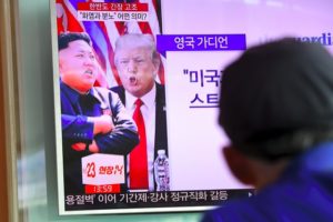 A man watches a television news programme showing US President Donald Trump (C) and North Korean leader Kim Jong-Un (L) at a railway station in Seoul on August 9, 2017. President Donald Trump issued an apocalyptic warning to North Korea on Tuesday, saying it faces "fire and fury" over its missile program, after US media reported Pyongyang has successfully miniaturized a nuclear warhead. / AFP PHOTO / JUNG Yeon-Je (Photo credit should read JUNG YEON-JE/AFP/Getty Images)
